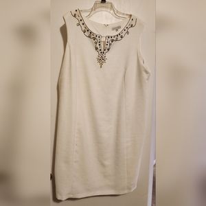 White linen-look lined dress with bronze neckline details